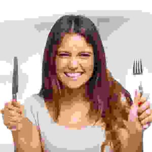 Portrait of a very hungry young woman